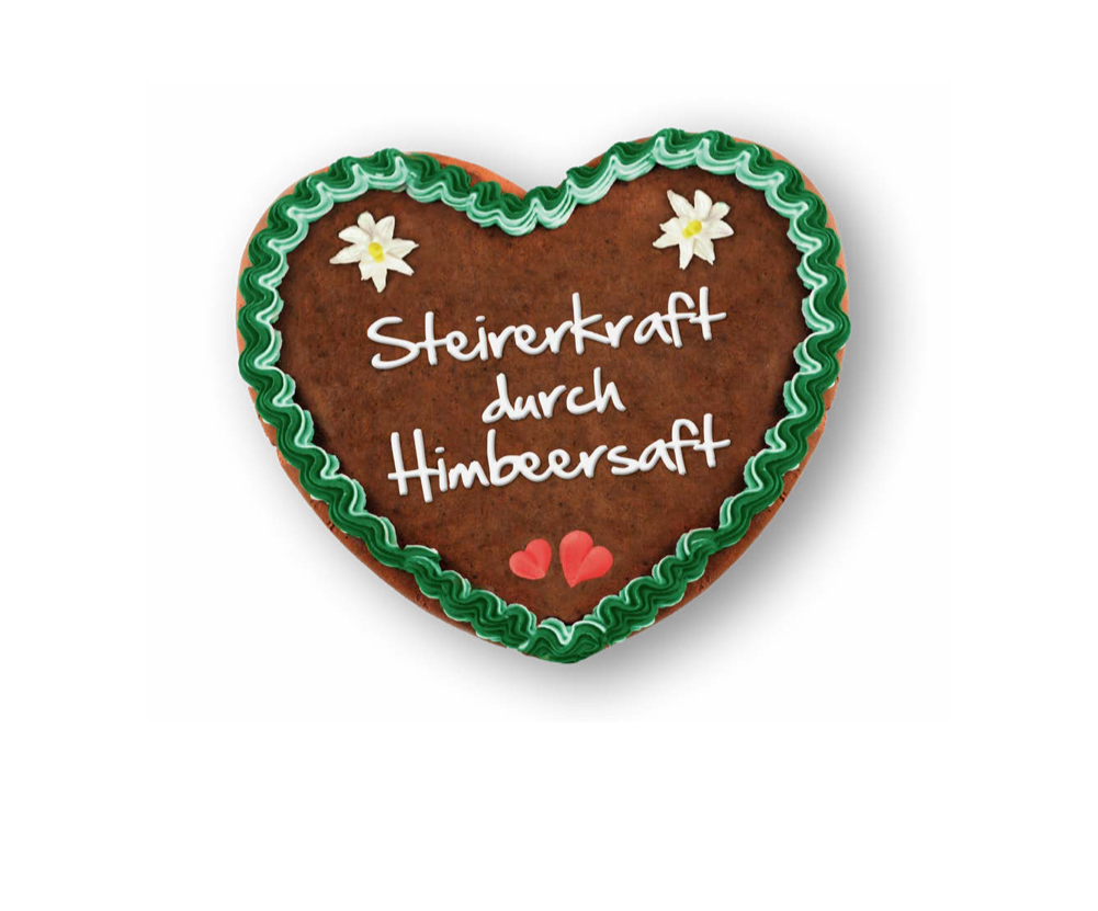 Lebkuchenherz mit einer Zuckergussaufschrift "Steirerkraft durch Himbeersaft"